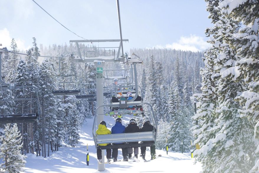In this Nov. 16, 2014 photo provided by Keystone Resort in Keystone, Colo., skiers take a lift on a snowy mountain. A recent report commissioned by the National Ski Areas Association shows that the percentage of people with household incomes over $100,000 who participate in snow sports has risen over the past eight seasons from 45 percent of ski area visitors to 56 percent of visitors. But there are ways to make a ski trip affordable, including skiing at smaller resorts, buying multi-day, half-day and advance tickets, and taking advantage of discounts for kids, seniors and groups. (AP Photo/Keystone Resort, Cody Mendoza)