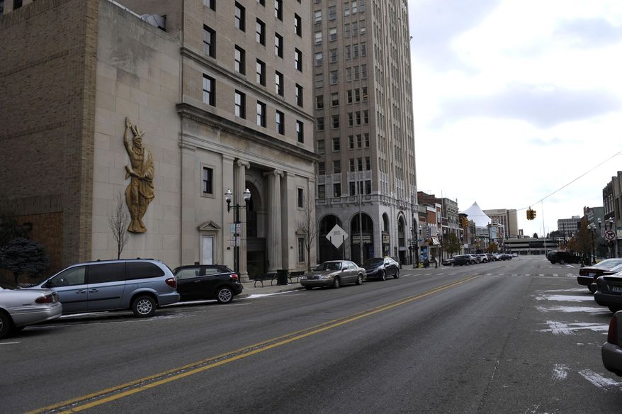 A Nov. 18, 2014 photo shows a street in downtown Pontiac, Mich. The 858-seat Strand Theatre for the Performing Arts is undergoing a $20 million renovation after being shuttered for nearly two decades. The project is just one component of roughly $300 million in new investments being poured into the area. (AP Photo/The Detroit News, David Coates)