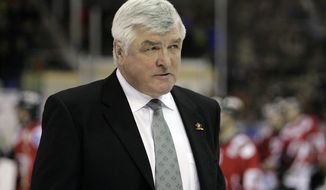 Team Canada&#39;s head coach Pat Quinn leaves the ring after the game between Team Canada and Germany&#39;s EHC Eisbaeren Berlin at the 80th Spengler Cup ice hockey tournament, in Davos, Switzerland, Saturday, December 30, 2006. (KEYSTONE/Salvatore Di Nolfi)