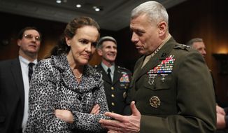 Defense Undersecretary for Policy Michele Flournoy, left,  talks with Marines Lt. Gen. John Paxton, director for operations, the Joint Staff, talk on Capitol Hill in Washington, Monday, Feb. 22, 2010, prior to their testifying before the Senate Armed Services Committee hearing on Afghanistan.  (AP Photo/Manuel Balce Ceneta)