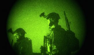 U.S. Special Operations forces engage in a joint operation with Afghan National Army soldiers targeting insurgents operating in Afghanistan&#39;s Farah province, Oct. 29, 2009. (Associated Press) ** FILE **