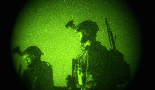 U.S. Special Operations forces engage in a joint operation with Afghan National Army soldiers targeting insurgents operating in Afghanistan&#x27;s Farah province, Oct. 29, 2009. (Associated Press) ** FILE **