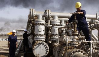 In this Dec. 13, 2009, file photo, oil personnel work at the Rumaila oil refinery, near the city of Basra, Iraq. OPEC&#x27;s purpose is to coordinate oil output to keep prices high and stable, to maximize member countries&amp;#8217; revenue but make sure global demand for oil stays strong. A steep, coordinated cut in output could stop and possibly reverse what has been a 30 percent decline in price over five months. (AP Photo/Nabil al-Jurani, File)FILE 