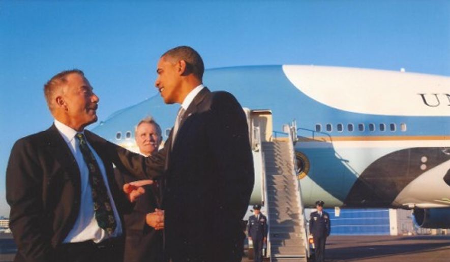 Terrence Patrick Bean, 66, a prominent gay-rights activist and Democratic donor, talks with President Obama with Air Force One in July 2010. (PQ Monthly)