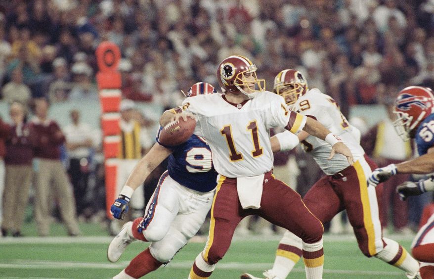  Washington Redskins quarterback Mark Rypien winds up and gets ready to release a pass during first quarter action at the Super Bowl in Minneapolis, on Sunday, Jan. 26, 1992. (AP Photo/Doug Mills) **FILE**