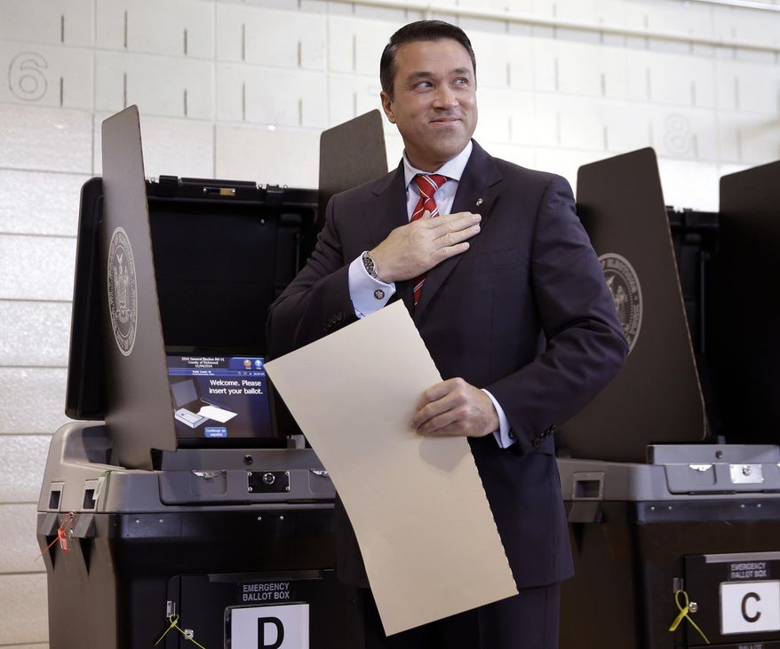 This Nov. 4, 2014, file photo shows Rep. Michael Grimm, R-N.Y., after voting in the borough of Staten Island in New York. Grimm won re-election this month, but he still faces a criminal investigation into possible campaign finance violations, as well as a 20-count indictment on tax fraud and other charges. (AP Photo/Seth Wenig, File)