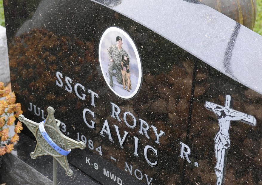 In this Nov. 7, 2014 photo, the grave of Rory Gavic is displayed at St. Francis Catholic Cemetery near Buffalo, Minn. Gavic was a young, decorated military member who served his country overseas twice, who had earned praise and the respect of his peers, who had volunteered as a Big Brother. His suicide in 2009 devastated his family, especially his mother Linda Sawatzke who killed herself four years later with the same handgun. (AP Photo/The St. Cloud Times, Dave Schwarz) ** FILE **