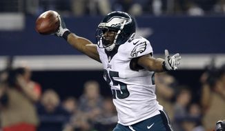 Philadelphia Eagles running back LeSean McCoy (25) celebrates as he enters the end zone for a touchdown against the Dallas Cowboys during the second half of an NFL football game, Thursday, Nov. 27, 2014, in Arlington, Texas. (AP Photo/Tim Sharp)