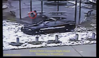 This still image taken from a surveillance video played at a news conference held by Cleveland Police, Wednesday, Nov. 26, 2014, shows Cleveland police officers arriving at Cudell Park on a report of a man with a gun.  Twelve-year-old Tamir Rice was fatally shot by a Cleveland police officer Saturday, Nov. 22, 2014, after he reportedly pulled a replica gun at the city park.  (AP Photo/Mark Duncan)