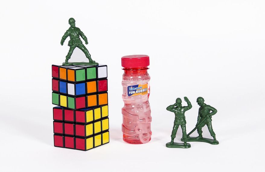 FILE - This undated file photo provided by the National Toy Hall of Fame shows bubbles, little green army men and the Rubik’s Cube which were inducted as new additions to the National Toy Hall of Fame. The toys enter the Rochester museum after being selected by a panel of expert judges from among a dozen finalists. (AP Photo/National Toy Hall of Fame, File)