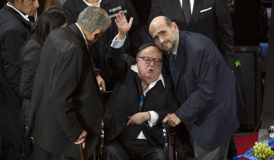 FILE - In this Feb. 29, 2012 file photo, Roberto Gomez Bolanos, popularly known as Chespirito, waves during an event in his honor at the National Auditorium in Mexico City. Televisa has confirmed reports that the legendary Mexican actor and comedian has died. He was 85. (AP Photo/Eduardo Verdugo, File)