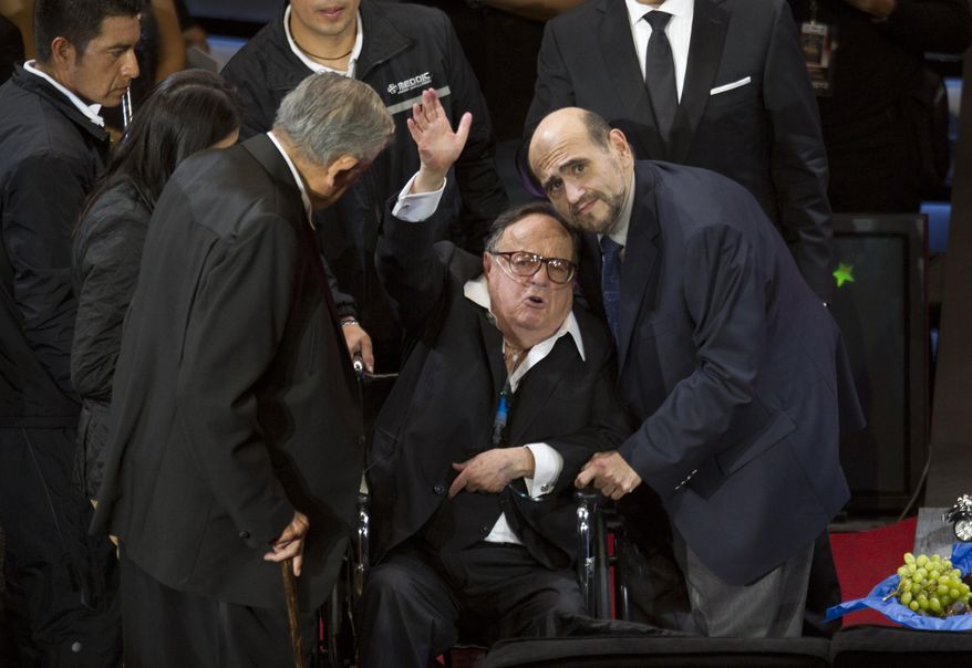 FILE - In this Feb. 29, 2012 file photo, Roberto Gomez Bolanos, popularly known as Chespirito, waves during an event in his honor at the National Auditorium in Mexico City. Televisa has confirmed reports that the legendary Mexican actor and comedian has died. He was 85. (AP Photo/Eduardo Verdugo, File)