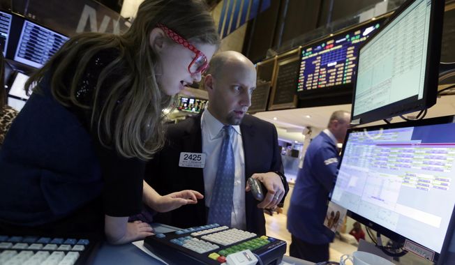 Darian Greenbaum, 7, recently visited her father Meric Greenbaum at his job at the New York Stock Exchange. New research finds that a father's economic and educational achievements can affect those of his children. (AP Photo/Richard Drew)