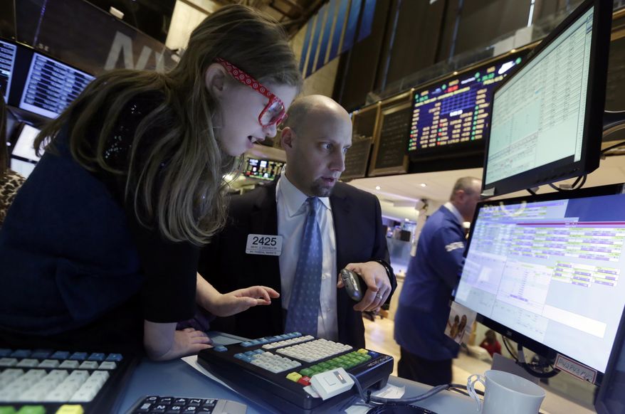 Darian Greenbaum, 7, recently visited her father Meric Greenbaum at his job at the New York Stock Exchange. New research finds that a father's economic and educational achievements can affect those of his children. (AP Photo/Richard Drew)