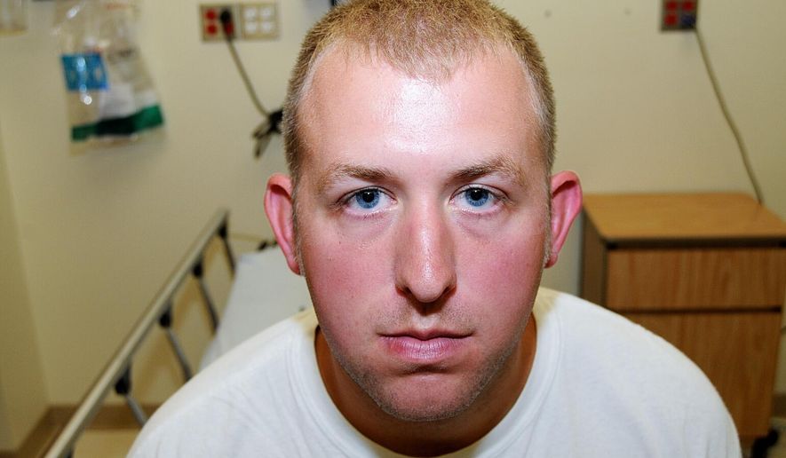 This undated file photo released by the St. Louis County Prosecuting Attorney&#39;s office on Monday, Nov. 24, 2014, shows Ferguson Police Officer Darren Wilson during his medical examination after he fatally shot Michael Brown, in Ferguson, Mo. The white police officer who killed Michael Brown has resigned from the Ferguson Police Department, nearly four months after the confrontation that fueled protests in the St. Louis suburb and across the U.S. (AP Photo/St. Louis County Prosecuting Attorney&#39;s Office, File)