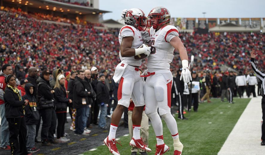 Rutgers wide receiver Leonte Carroo, left, celebrates his touchdown with Tyler Kroft, right, during the first half of an NCAA college football game against Maryland, Saturday, Nov. 29, 2014, in College Park, Md. Rutgers won 41-38.  (AP Photo/Nick Wass)