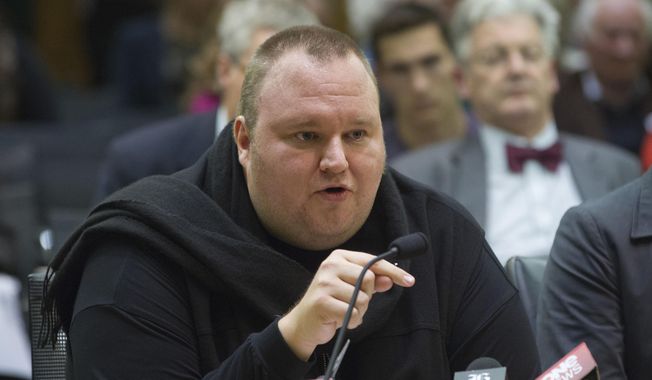 Internet entrepreneur Kim Dotcom speaks during the Intelligence and Security select committee hearing at Parliament in Wellington, New Zealand, July 3, 2013. (Associated Press) 