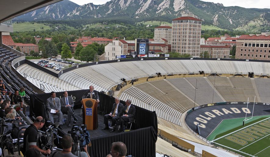 The campus and foothills are seen in the background during a news conference at the University of Colorado&#39;s football stadium in Boulder, Colorado. (Associated Press)