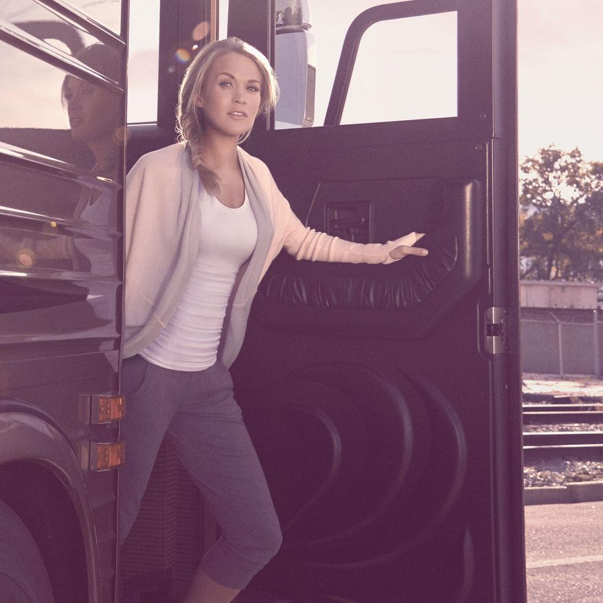 This photo provided by DICK’S Sporting Goods shows Carrie Underwood wearing her own line of athletic wear with DICK’S Sporting Goods, called Calia by Carrie Underwood, which matches up her love of fashion and fitness. (AP Photo/DICK’S Sporting Goods)