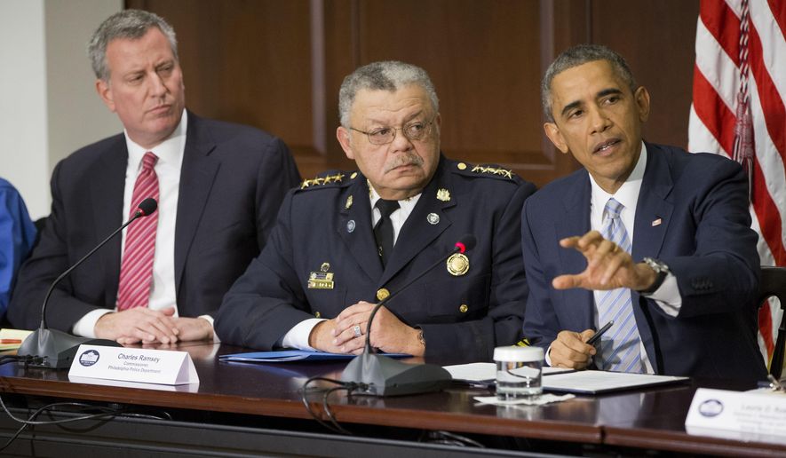 President Barack Obama, right, speaks during his meeting with elected officials, law enforcement officials and community and faith leaders in the Old Executive Office Building on the White House Complex in Washington, Monday, Dec. 1, 2014. Obama said that in the wake of the shooting of an unarmed 18-year-old man in Ferguson, Missouri, he wants to make sure to build better trust between police and the communities they serve. Also at the meeting are New York Mayor Bill de Blasio, left, and Charles Ramsey, center, Commissioner of the Philadelphia Police Dept. (AP Photo/Pablo Martinez Monsivais) **FILE**