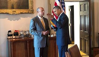 President Barack Obama talks with Homeland Security Secretary Jeh Johnson in the Cabinet Room of the White House, July 25, 2014. (Official White House Photo by Pete Souza)