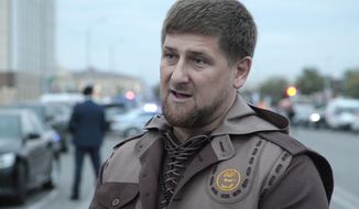 Chechen regional leader Ramzan Kadyrov talks with press in the Chechen regional capital, Grozny, Russia, in this Oct. 5, 2014 photo. A gun battle broke out after midnight Thursday  Dec. 4, 2014 in the capital of Russia&#39;s North Caucasus republic of Chechnya, puncturing the patina of stability ensured by years of heavy-handed rule by Chechen leader Ramzan Kadyrov.  (AP Photo/Musa Sadulayev, File)