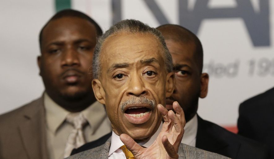 The Rev. Al Sharpton is surrounded by other civil rights leaders while he speaks during a news conference at the National Action Network headquarters in New York, Thursday, Dec. 4, 2014. (AP Photo/Seth Wenig) ** FILE **