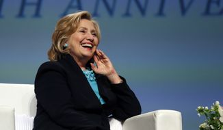 Former Secretary of State Hillary Rodham Clinton laughs when asked what would be good qualities for a &quot;First Gentleman&quot; during a question and answer session at the Massachusetts Conference for Women in Boston, Thursday, Dec. 4, 2014. (AP Photo/Elise Amendola)
