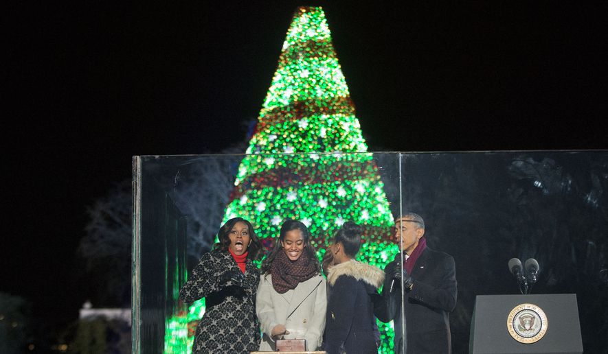 President Obama, first lady Michelle Obama and daughters Malia and Sasha participate in the National Christmas Tree lighting ceremony Thursday. (AP Photo/Pablo Martinez Monsivais)