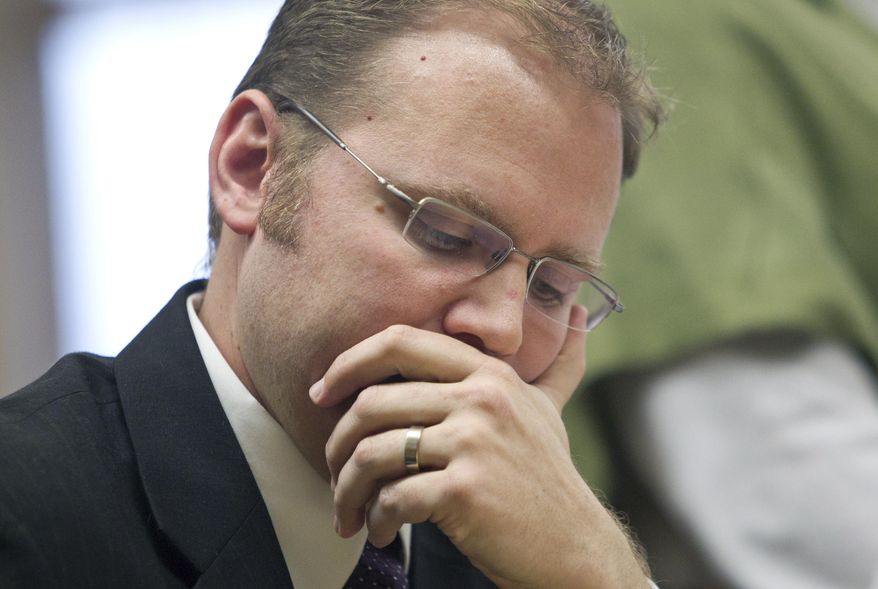 Defense attorney David Glancy listens during the appeal of a lower-court judge's dismissal of the murder case against Sean Michael Phillips in the June 2011 disappearance of his 4 1/2-month-old daughter, Katherine Phillips, also known as "Baby Kate," inside the Mason County Courthouse in Ludington, Mich., Friday, Dec. 5, 2014. (AP Photo/The Muskegon Chronicle, Cory Morse ) ALL LOCAL TELEVISION OUT; LOCAL TELEVISION INTERNET OUT