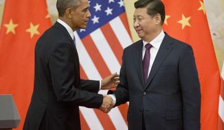 FILE - In this Nov. 12, 2014 file photo, President Barack Obama shakes hands with  Chinese President Xi Jinping at the conclusion of their joint news conference at the Great Hall of the People in Beijing. Six countries produce nearly 60 percent of global carbon dioxide emissions. China and the United States combine for more than two-fifths. The planet’s future will be shaped by what these top carbon polluters do about the heat-trapping gases blamed for global warming.  (AP Photo/Pablo Martinez Monsivais, File)