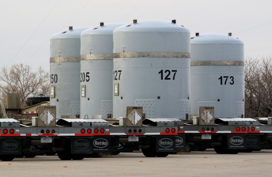 FILE - In this on March 6, 2014, file photo, Empty nuclear waste shipping containers sit in front of the Waste Isolation Pilot Plant near Carlsbad, N.M. New Mexico on Saturday, Dec. 6 2014 levied more than $54 million in penalties against the U.S. Department of Energy for numerous violations that resulted in the indefinite closure of the nation's only underground nuclear waste repository. The state Environment Department delivered a pair of compliance orders to Energy Secretary Ernest Moniz, marking the state's largest penalty ever imposed on the agency. (AP Photo/Susan Montoya Bryan, File)
