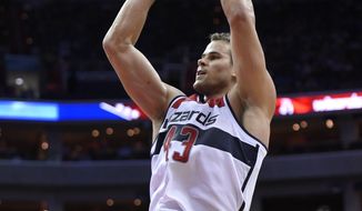 Washington Wizards forward Kris Humphries (43) shoots during the second half of an NBA basketball game against the Denver Nuggets, Friday, Dec. 5, 2014, in Washington. (AP Photo/Nick Wass)