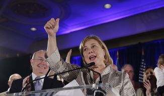 Sen. Mary Landrieu, D-La., speaks to supporters as she concedes defeat in her Senate runoff election against Rep. Bill Cassidy, R-La., in New Orleans, Saturday, Dec. 6, 2014. Left is her husband Frank Snellings. (AP Photo/Gerald Herbert)