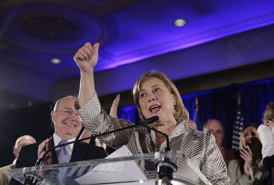Sen. Mary Landrieu, D-La., speaks to supporters as she concedes defeat in her Senate runoff election against Rep. Bill Cassidy, R-La., in New Orleans, Saturday, Dec. 6, 2014. Left is her husband Frank Snellings. (AP Photo/Gerald Herbert)
