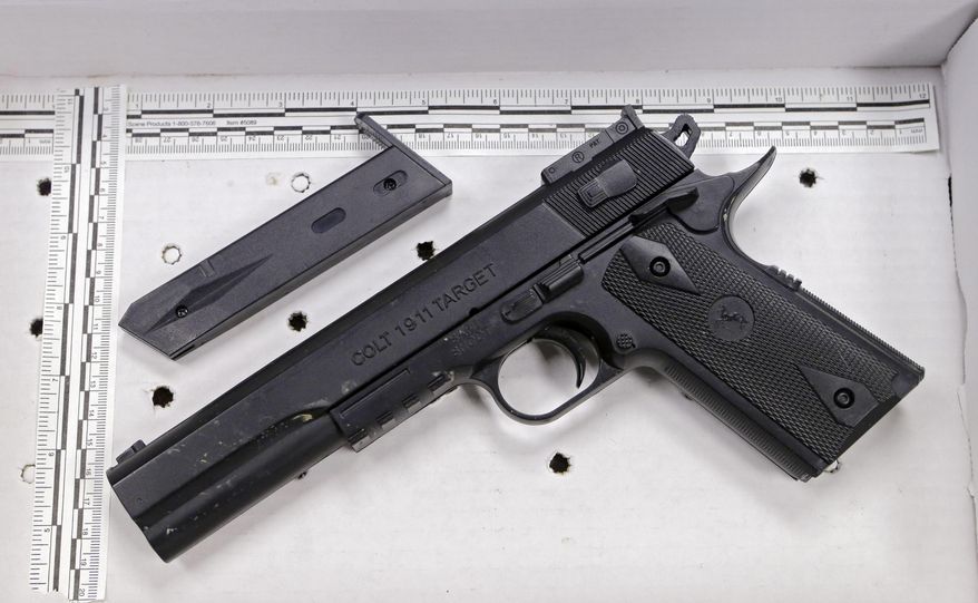 In a Wednesday, Nov. 26, 2014, file photo, a fake handgun taken from 12-year-old Tamir Rice, who was fatally shot by Cleveland police, is displayed after a news conference in Cleveland. (AP Photo/Mark Duncan, File)