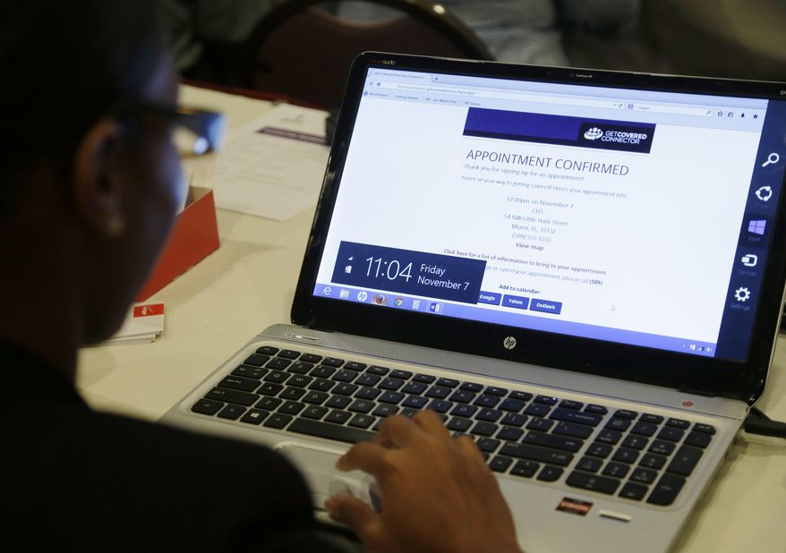 In this Friday, Nov. 7, 2014 photo, navigator Laetitia Badio, front, works with the Get Covered Connector tool during a training session for navigators held by Enroll America in Fort Lauderdale, Fla. Navigators signed up people for insurance coverage when the second enrollment period for the Affordable Care Act began Nov. 15. (AP Photo/Lynne Sladky)