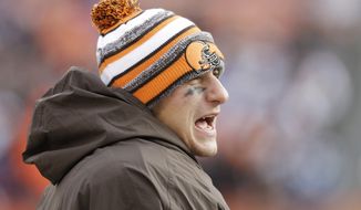 Cleveland Browns quarterback Johnny Manziel watches from the sidelines in the third quarter of an NFL football game against the Indianapolis Colts Sunday, Dec. 7, 2014, in Cleveland. (AP Photo/Tony Dejak)