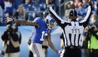 New York Giants wide receiver Odell Beckham Jr. (13) celebrates a 15-yard touchdown pass against the Tennessee Titans in the first half of an NFL football game Sunday, Dec. 7, 2014, in Nashville, Tenn. (AP Photo/Mark Zaleski)