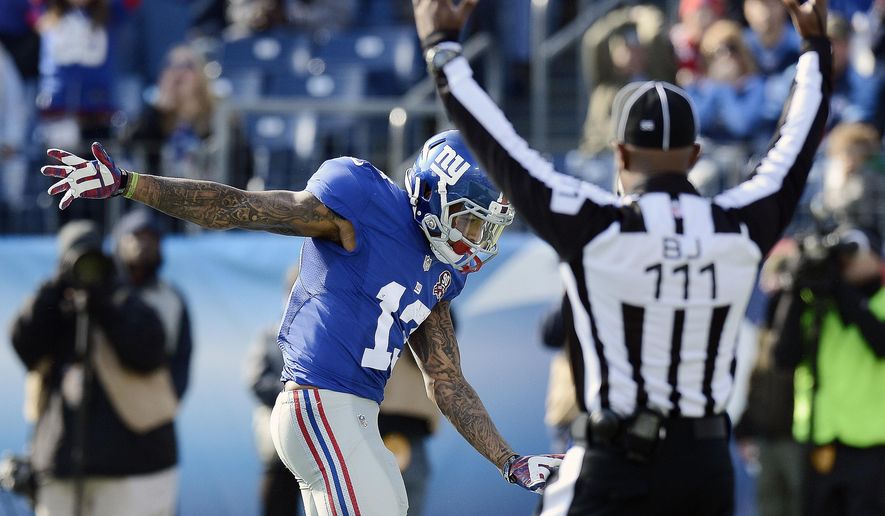 New York Giants wide receiver Odell Beckham Jr. (13) celebrates a 15-yard touchdown pass against the Tennessee Titans in the first half of an NFL football game Sunday, Dec. 7, 2014, in Nashville, Tenn. (AP Photo/Mark Zaleski)