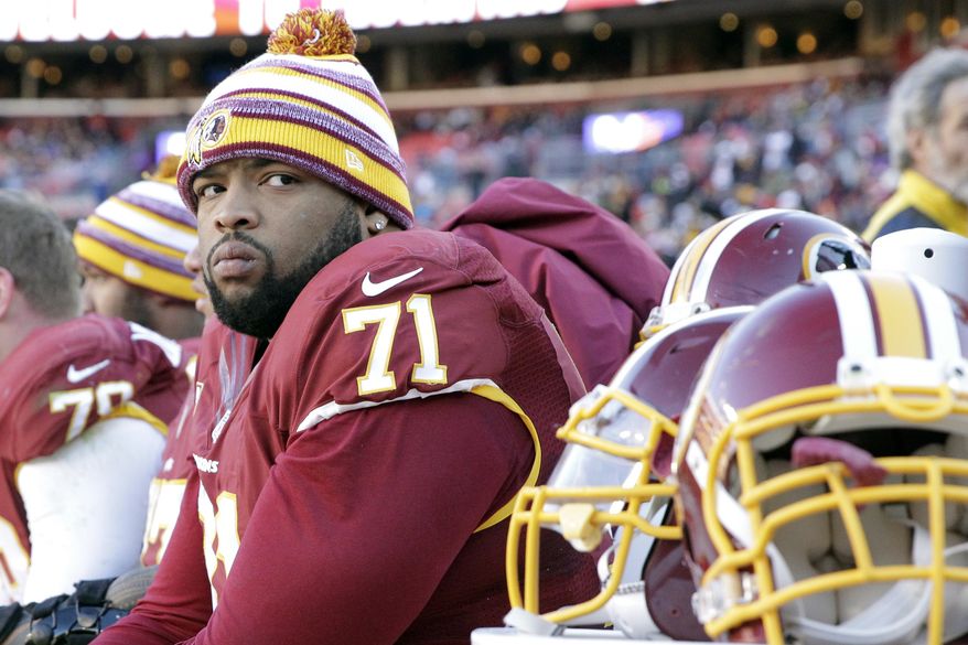 Washington Redskins tackle Trent Williams (71) watches the action from the bench during the first half of an NFL football game against the St. Louis Rams in Landover, Md., Sunday, Dec. 7, 2014. (AP Photo/Mark Tenally) ** FILE **