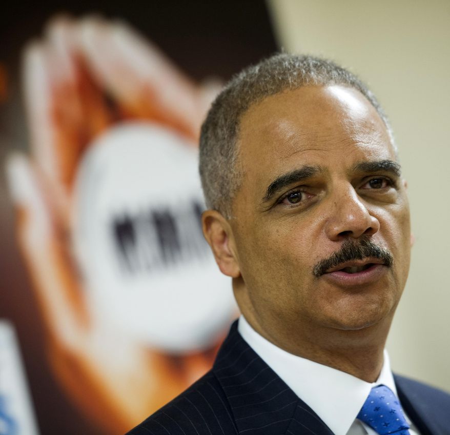 Attorney General Eric Holder speaks with the news media after touring the Northern Virginia Juvenile Detention Center with Education Secretary Arne Duncan in Alexandria, Va., Monday, Dec. 8, 2014. (AP Photo/Cliff Owen) ** FILE **
