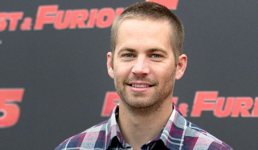 Paul Walker 1973-2013 — the star of the &quot;Fast &amp; Furious&quot; movie series died in a car crash north of Los Angeles. He was 40. (AP Photo/Andrew Medichini, File)