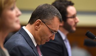MIT economist Jonathan Gruber listens on Capitol Hill in Washington, Tuesday, Dec. 9, 2014, as he testified before the House Oversight Committee health care hearing. (AP Photo/Molly Riley)