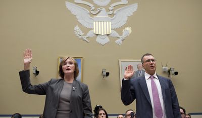 MIT economist Jonathan Gruber, right, is sworn in prior to testifying before a House Oversight Committee health care hearing in December, 2014. (AP Photo/Molly Riley)