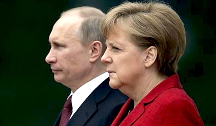 German Chancellor Angela Merkel, right, welcomes President of Russia Vladimir Putin, left, at the chancellery in Berlin, Germany, June 1, 2012. (Associated Press) ** FILE **