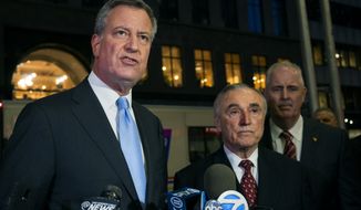 New York City Mayor Bill de Blasio, left, discusses investigation details Tuesday, Dec. 9, 2014, in New York, along with New York City Police Commissioner William Bratton, center, and Chief of Detectives Robert Boyce, after an incident in the early morning hours in which a man with a history of mental illness slipped into the headquarters of a major Jewish organization in the Brooklyn borough and stabbed an Israeli student in the head as he was studying in the library. (AP Photo/Craig Ruttle) ** FILE **