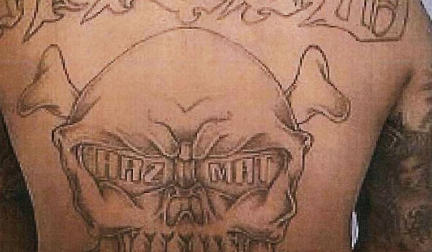 This undated photo provided by the U.S. Department of Justice shows a tattoo on a member of the Big Hazard gang on the east side of Los Angeles. (AP Photo/U.S. Department of Justice) **FILE**