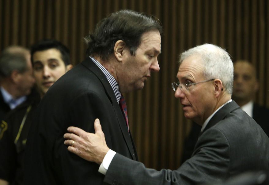 Bob Bashara, left, speaks to his attorney Michael McCarthy during a break during closing arguments in this trial in the Wayne County 3rd Circuit courtroom Wednesday, Dec. 10, 2014, in Detroit. Bashara, a former Rotary Club president arranged to have his wife killed because his marriage was colliding with his desire to indulge in bondage and masochism with other women, a prosecutor told jurors Wednesday at the conclusion of a long trial that revealed a secret life in suburban Detroit. (AP Photo/Detroit Free Press, Mandi Wright) DETROIT NEWS OUT; NO SALES Mandi Wright/Detroit Free Press