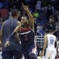 Washington Wizards guard John Wall (2) celebrates after teammate Bradley Beal tipped in the game-winning basket as time expired at the end of the second half of an NBA basketball game against the Orlando Magic in Orlando, Fla., Wednesday, Dec. 10, 2014. The Wizards won 91-89. (AP Photo/Phelan M. Ebenhack)